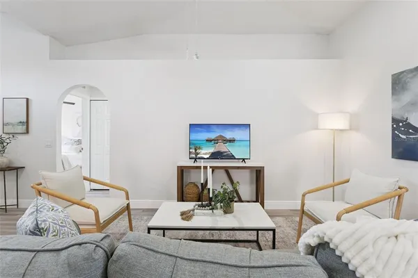 a living room with furniture and a table