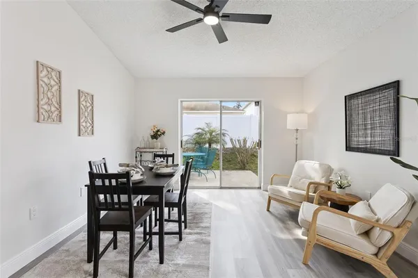 a dining room with furniture and window