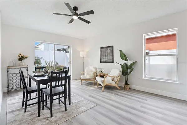 a view of a dining room with furniture and a window