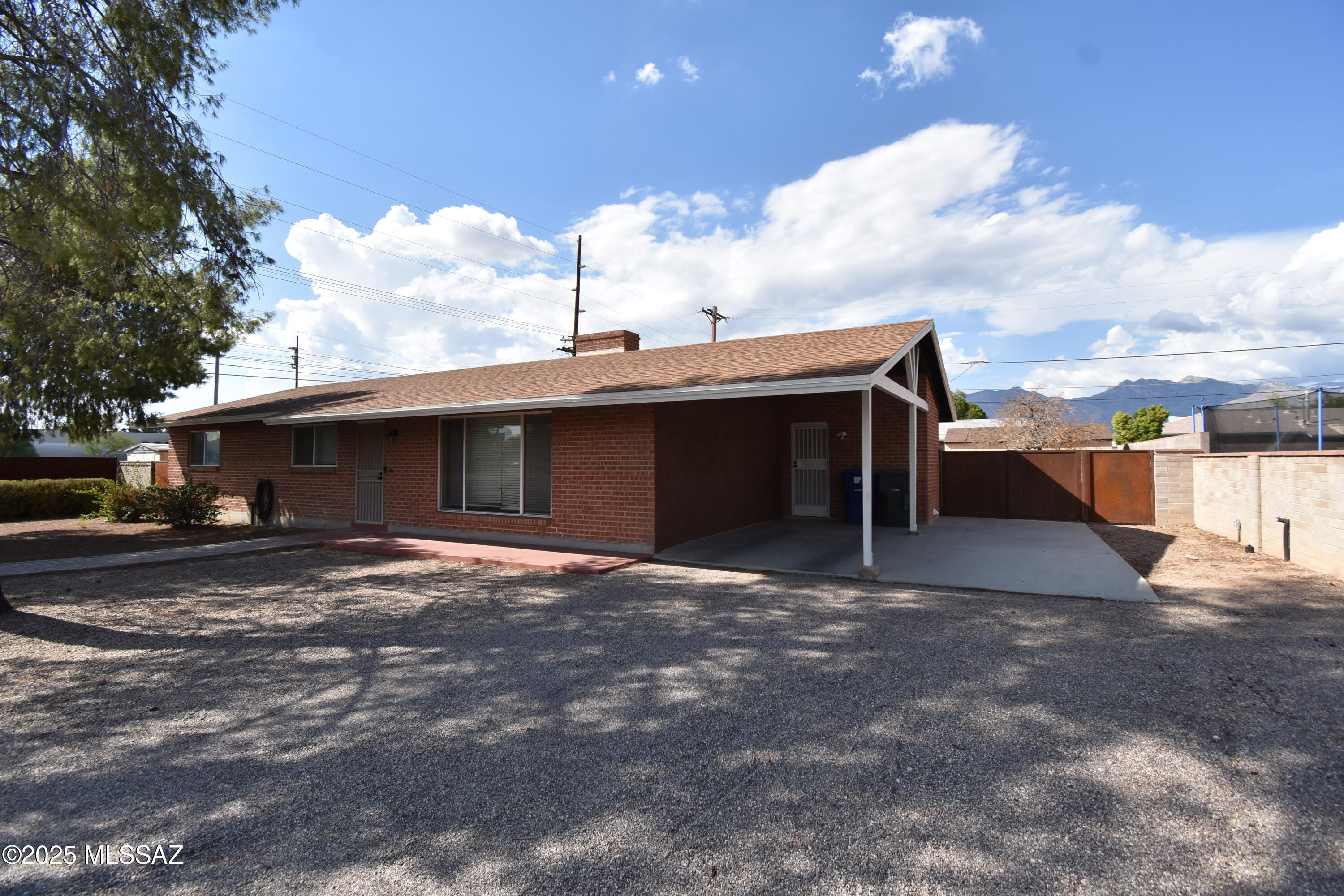 5501 East Spring Street Tucson, AZ 85712 - Photo 2 of 32 a view of a house with a yard