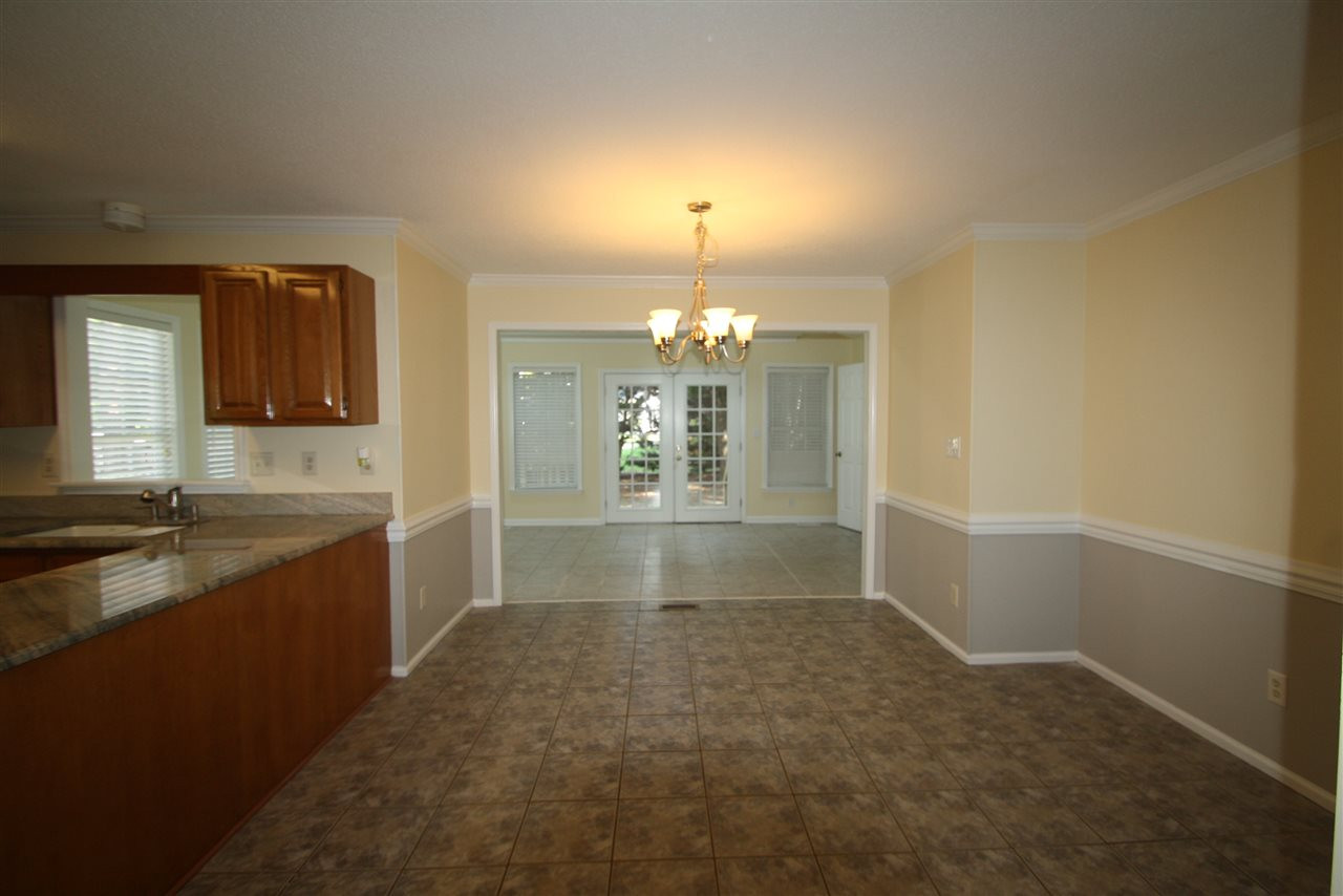 11924 Radner Way Raleigh, NC 27613 - Photo 10 of 25 Breakfast area looking into sunroom