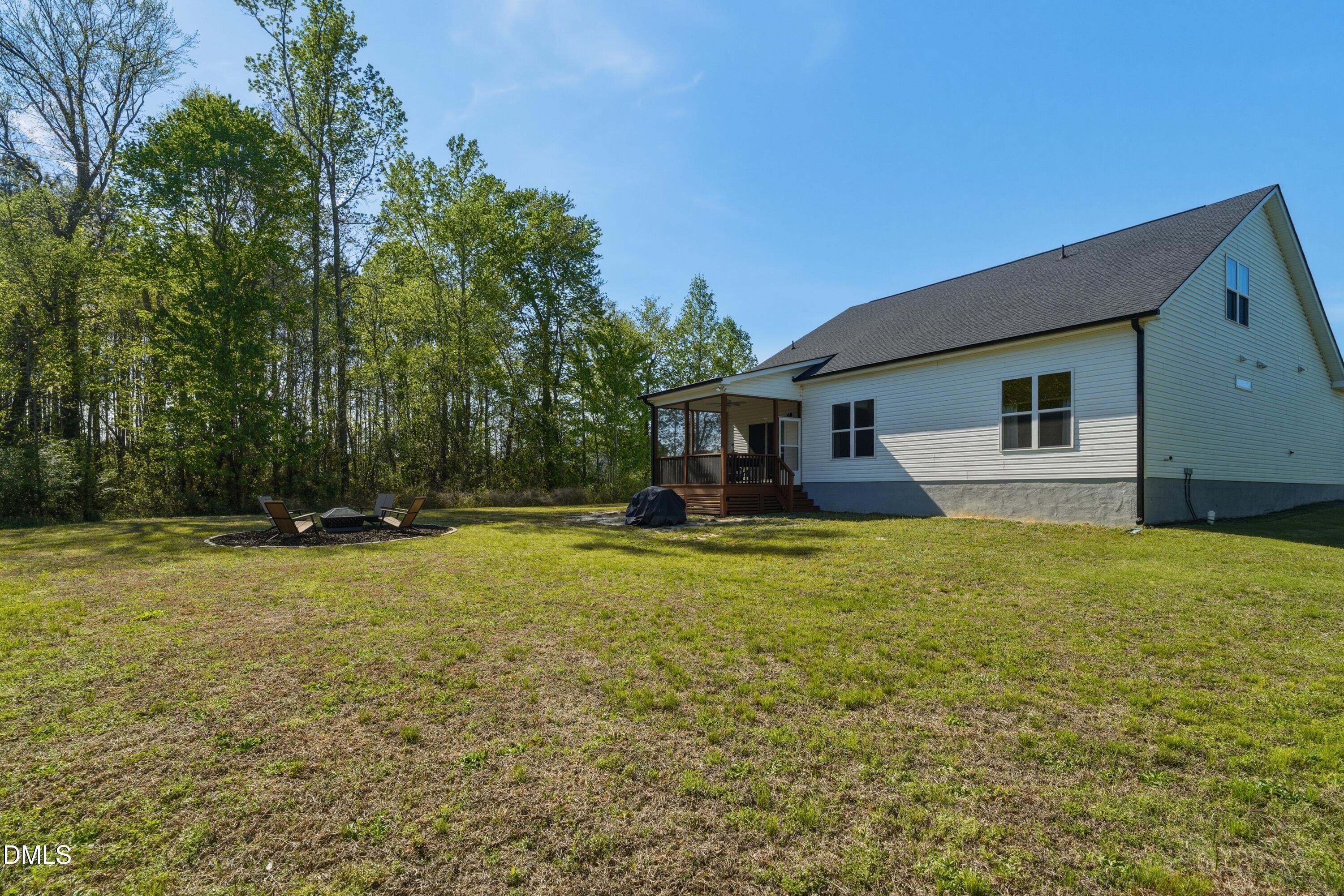 386 Howards Crossing Drive Wendell, NC 27591 - Photo 24 of 31 a front view of a house with yard and tree s