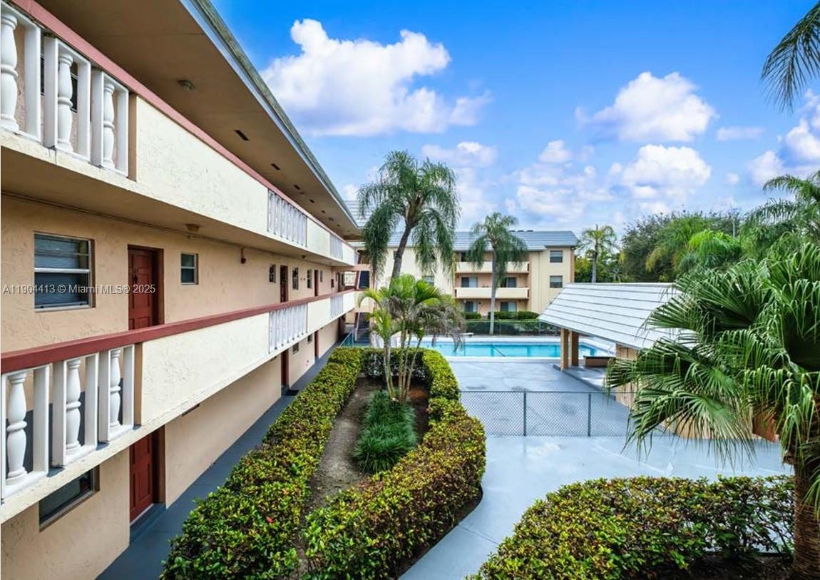 8951 Southwest 72nd Street, Unit 337 Miami, FL 33173 - Photo 6 of 9 a view of house along with deck and outdoor seating