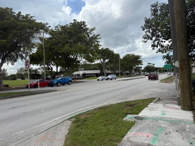 8951 Southwest 72nd Street, Unit 337 Miami, FL 33173 - Photo 9 of 9 a view of street with parked cars