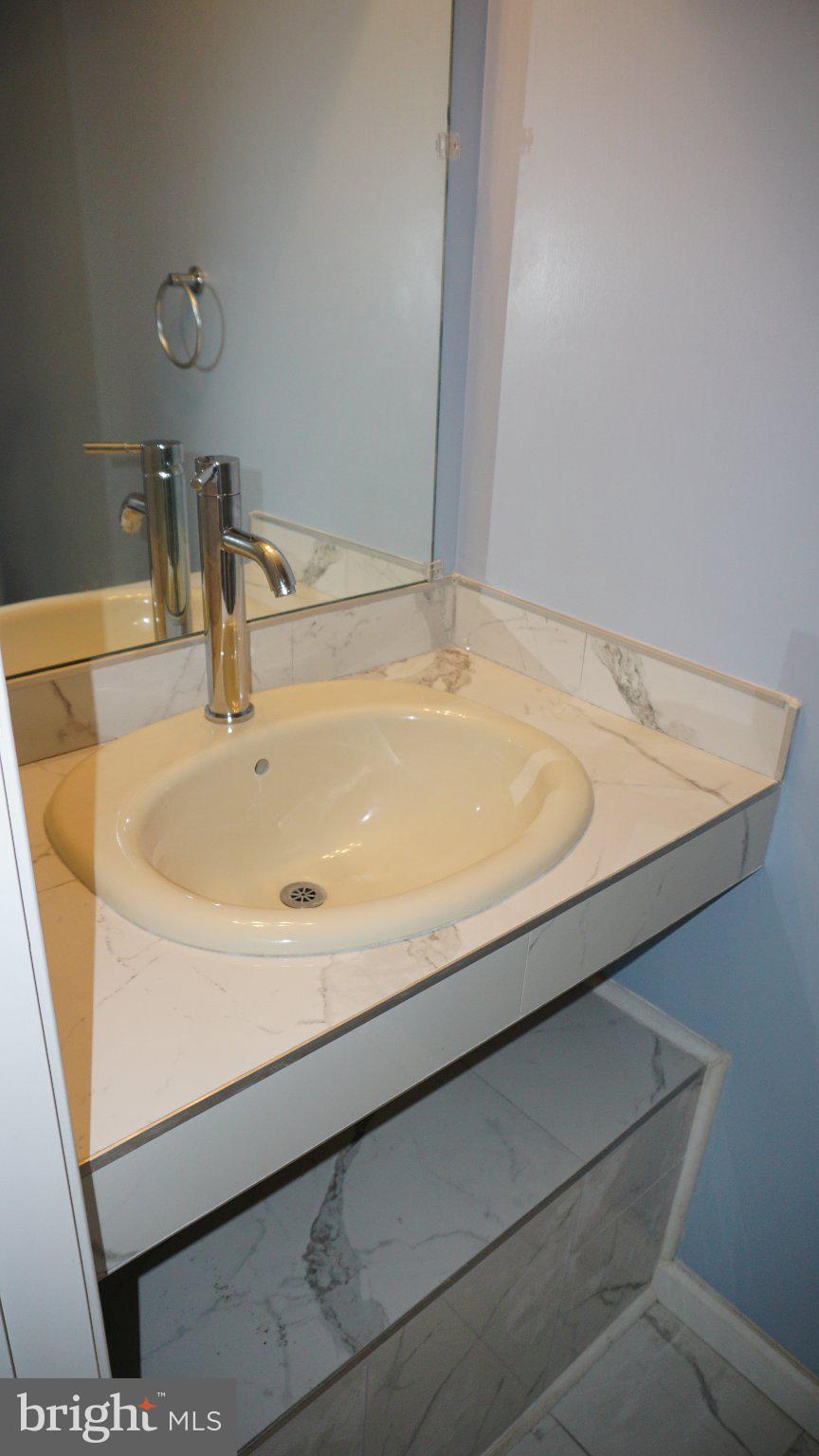 5854 Deale Churchton Road Deale, MD 20751 - Photo 52 of 57 Sleek bathroom with modern finishes.