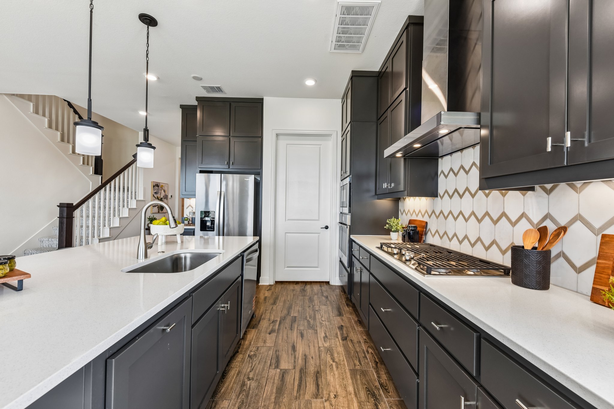 19113 Freeman Circle Austin, TX 78738 - Photo 14 of 37 A well-appointed kitchen showcasing contemporary design and modern amenities.