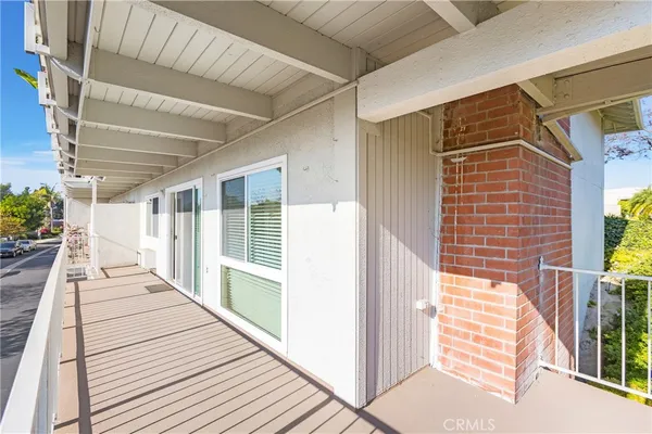 a balcony with wooden floor