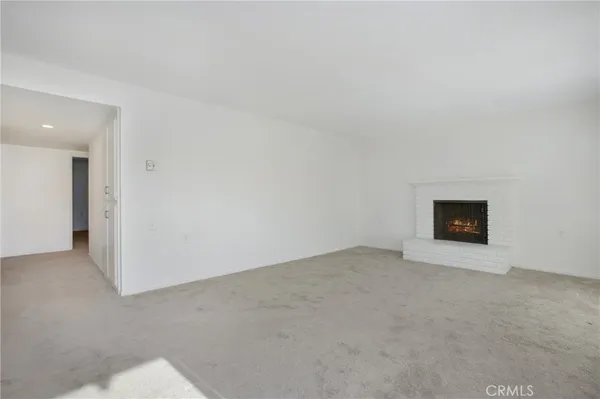 an empty room with a fireplace