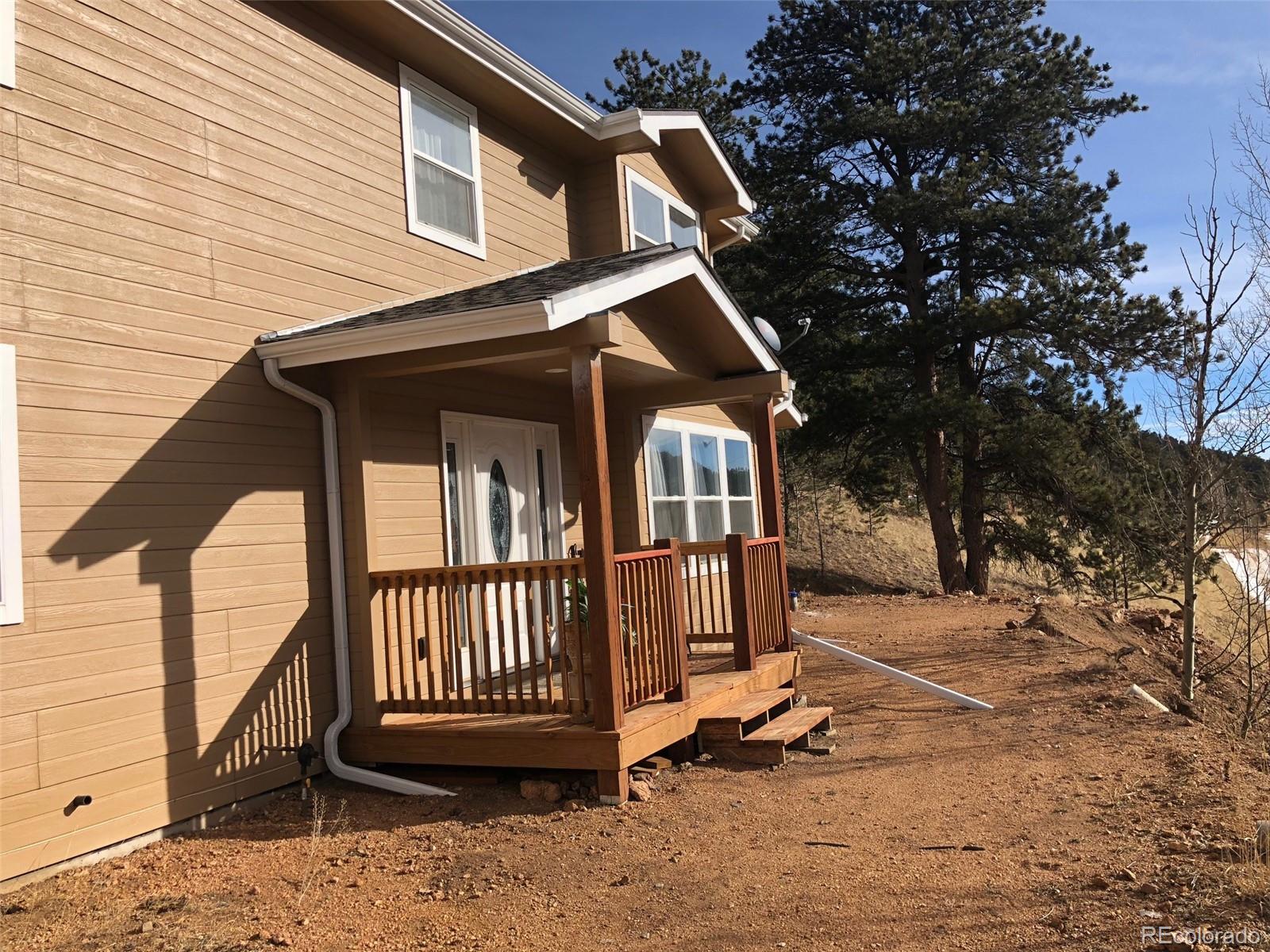 217 Bishop Road Bailey, CO 80421 - Photo 12 of 15 a view of a house with a yard