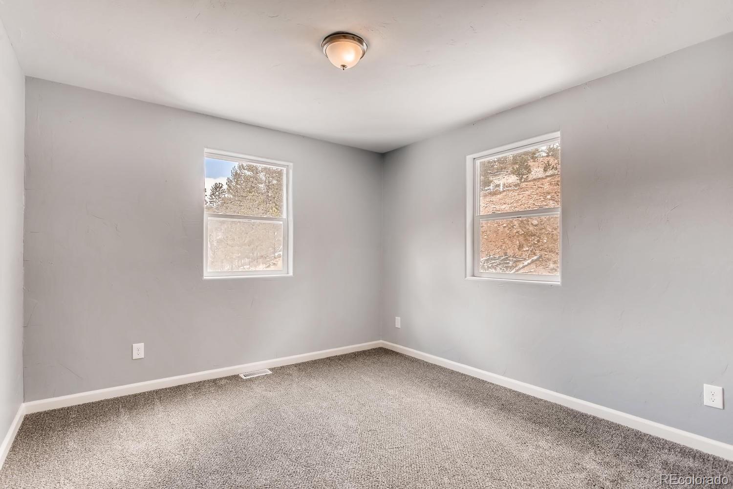 217 Bishop Road Bailey, CO 80421 - Photo 9 of 15 an empty room with a window