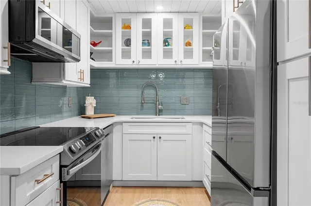 a kitchen with a sink and cabinets