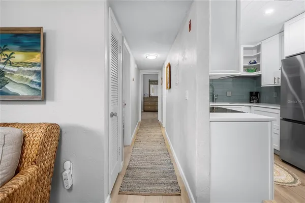 a view of hallway with seating and living room
