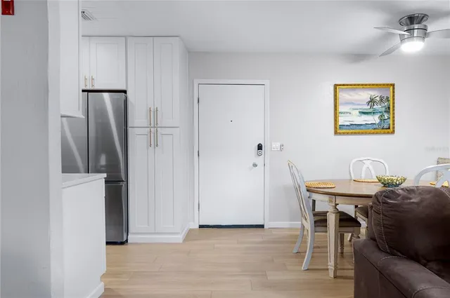 a view of a workspace with furniture and wooden floor