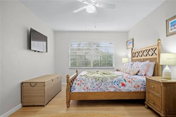 a bedroom with bed and window