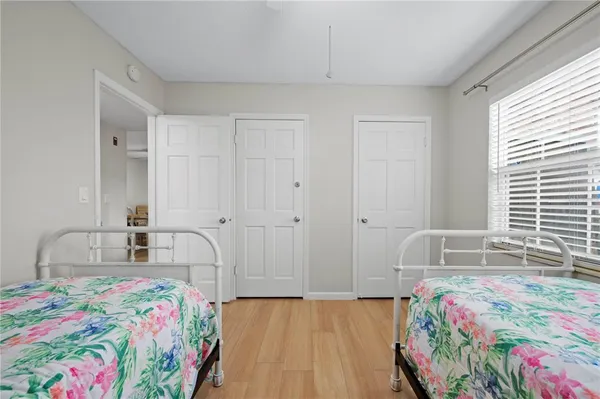 a bedroom with bed and a window