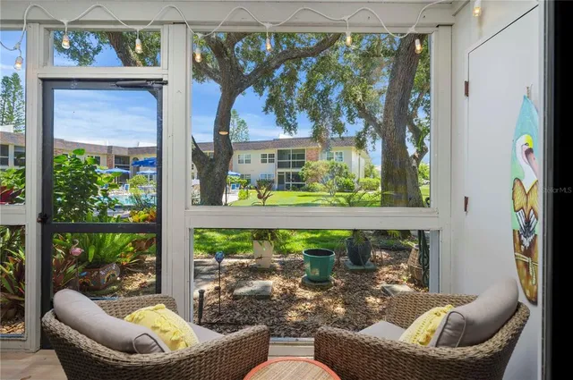 a outdoor living space with patio furniture and potted plants