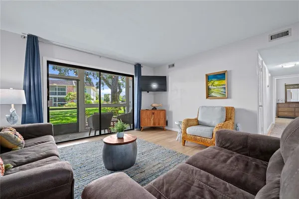 a living room with furniture and a large window