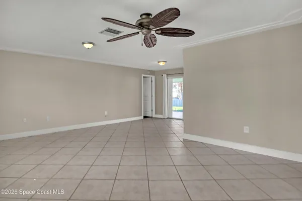 a view of an empty room with a window