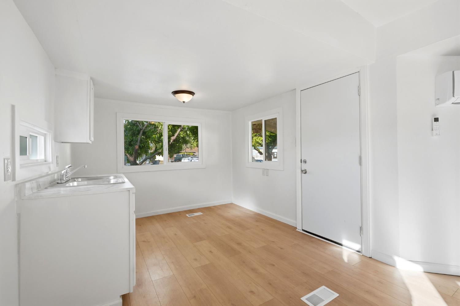 715 South Kaweah Avenue, Unit 9 Exeter, CA 93221 - Photo 6 of 15 a view of empty room with wooden floor and fan
