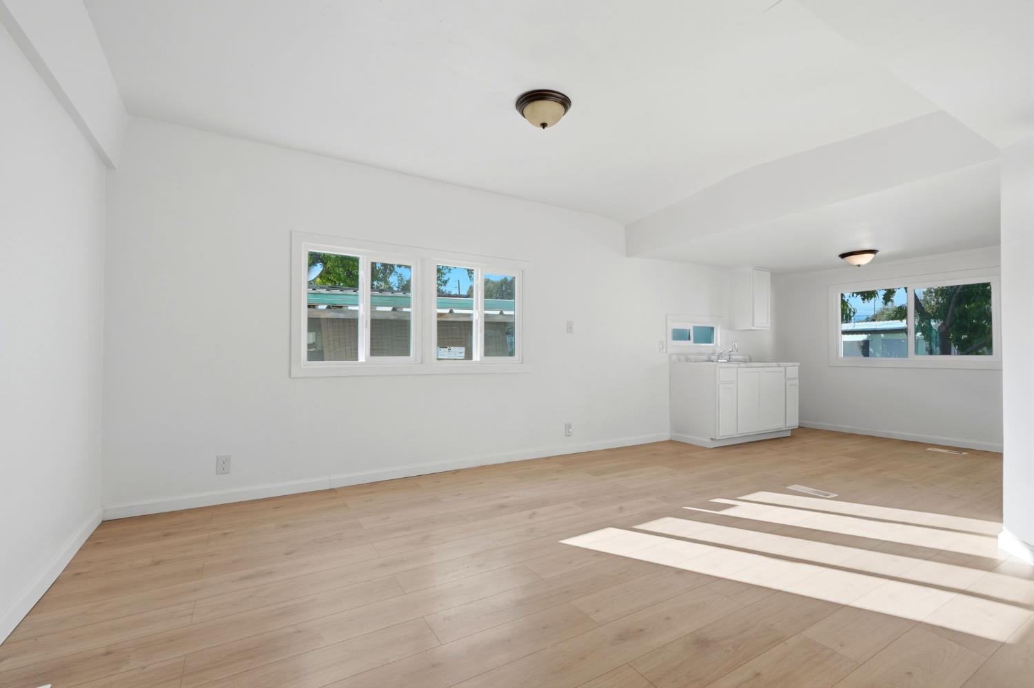 715 South Kaweah Avenue, Unit 9 Exeter, CA 93221 - Photo 8 of 15 a view of an empty room with a window