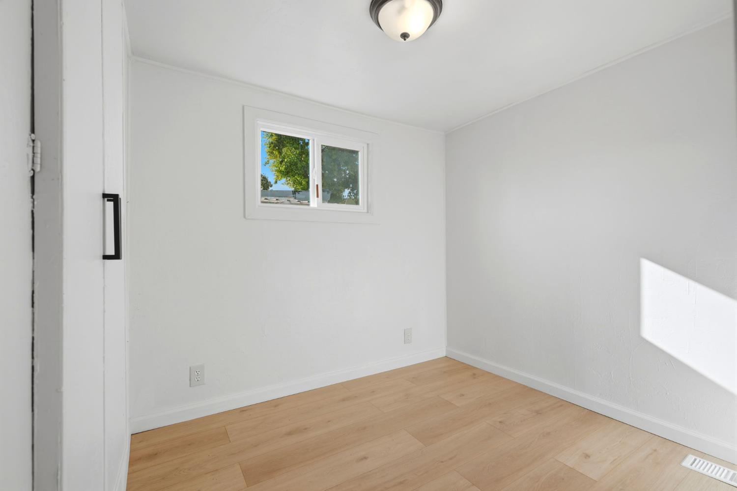 715 South Kaweah Avenue, Unit 9 Exeter, CA 93221 - Photo 9 of 15 a view of an empty room with a window