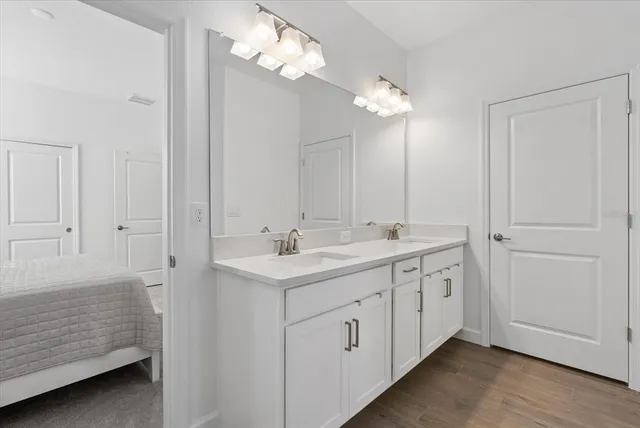 a bathroom with a shower and a room