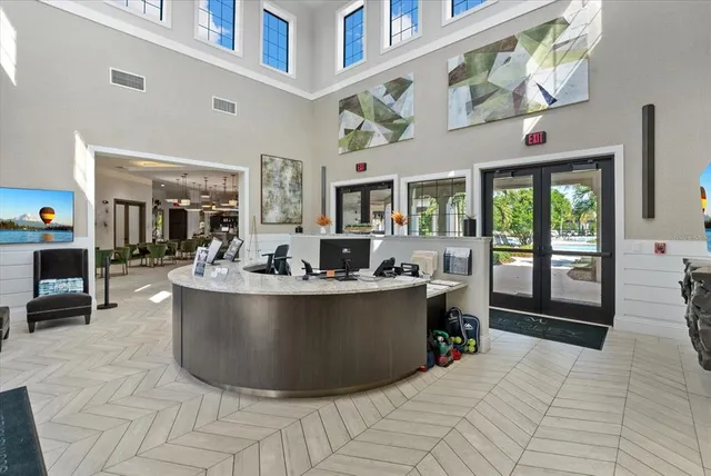 a living room with lots of furniture and white walls