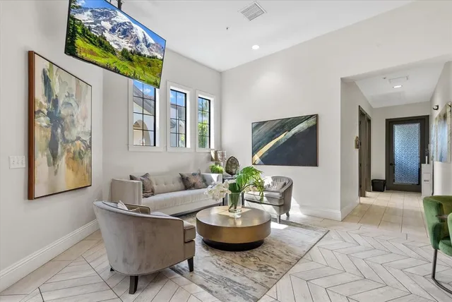 a kitchen with refrigerator and table