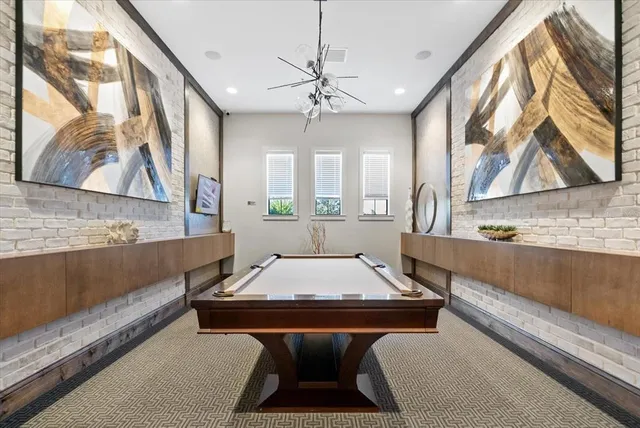a view of a dining room with furniture and window