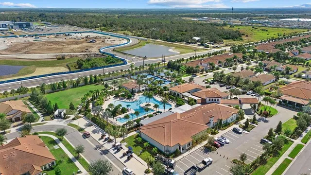 an aerial view of residential houses with outdoor space
