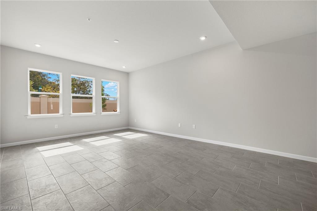 4664 Arboretum Circle, Unit 102 Naples, FL 34112 - Photo 25 of 39 a view of an empty room with a window