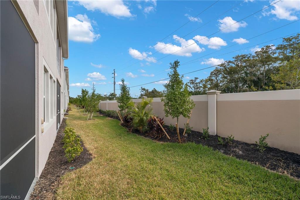 4664 Arboretum Circle, Unit 102 Naples, FL 34112 - Photo 38 of 39 a view of a backyard