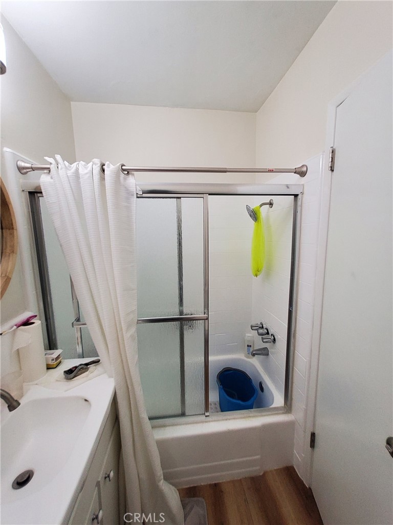 728 Cedar Avenue, Unit 29 Long Beach, CA 90813 - Photo 13 of 14 a bathroom with a sink a toilet and a mirror
