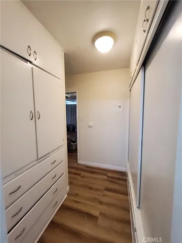 a bedroom with a bed and a mirror