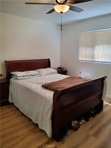 a bedroom with a bed and a mirror