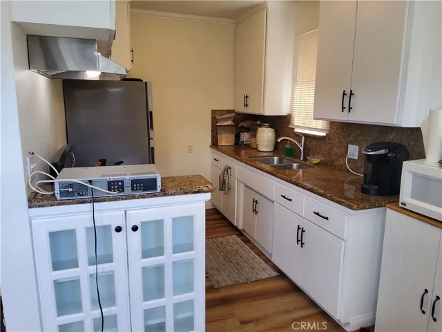 a kitchen with a stove and a refrigerator