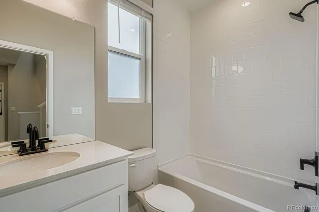 a view of a white building among the street