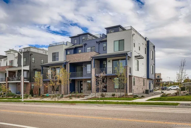 a view of a house with a swimming pool and a yard