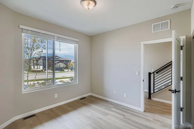 a kitchen with kitchen island a sink a stove and chairs