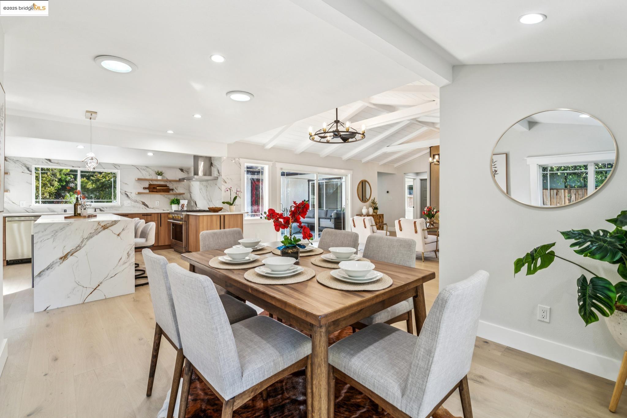 1333 Milton Avenue Walnut Creek, CA 94596 - Photo 17 of 59 a view of a dining room with furniture and a chandelier