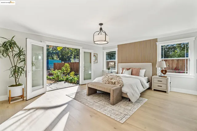 a bedroom with a bed dresser and a window