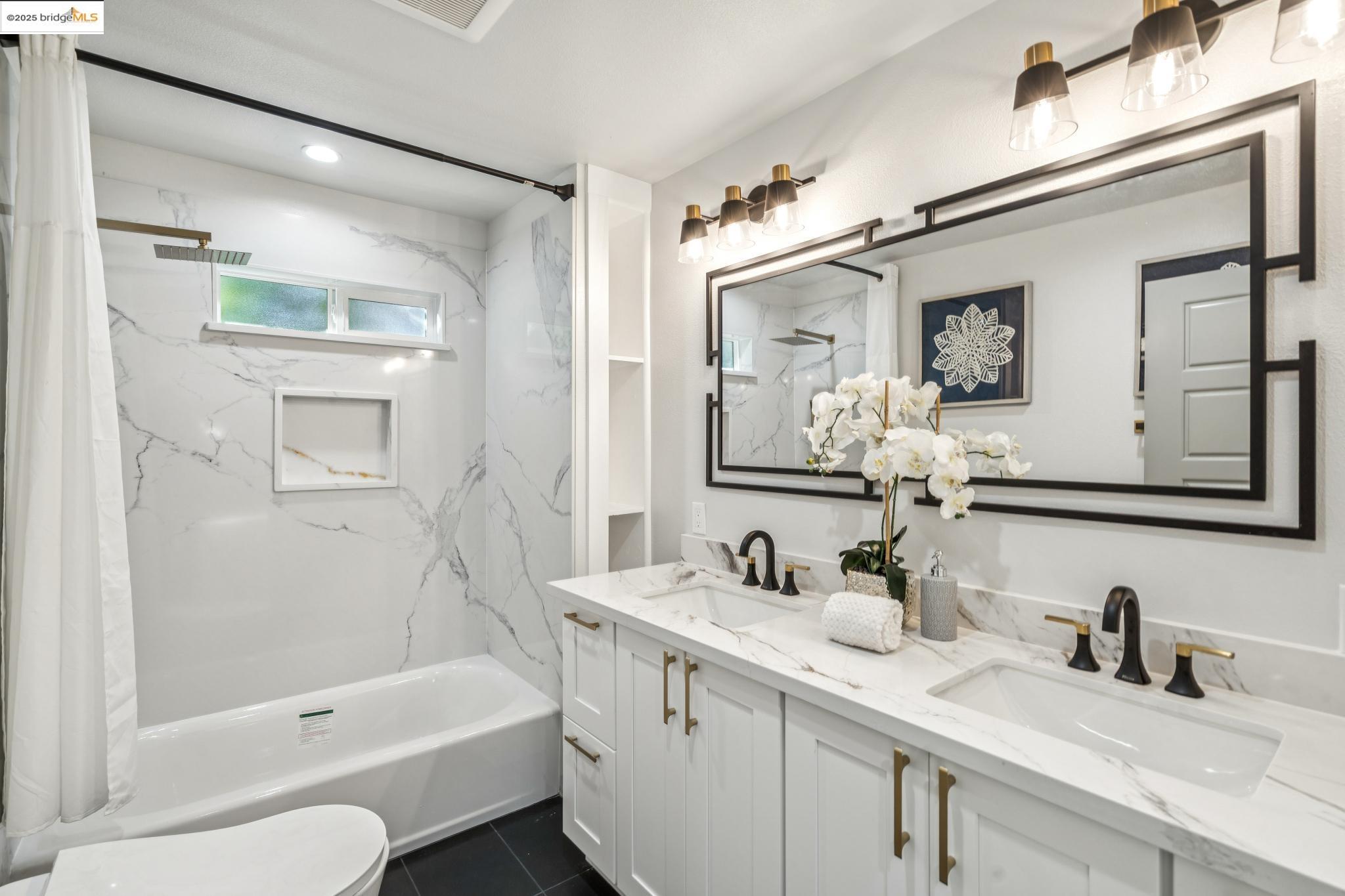 1333 Milton Avenue Walnut Creek, CA 94596 - Photo 26 of 59 a bathroom with a tub sink and mirror