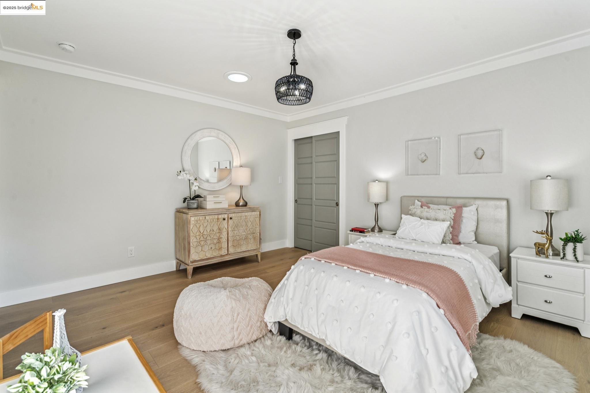 1333 Milton Avenue Walnut Creek, CA 94596 - Photo 29 of 59 a bedroom with a bed and a chandelier