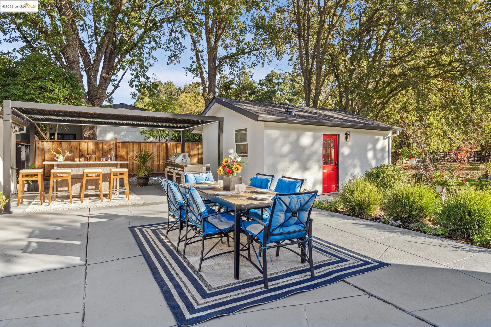 1333 Milton Avenue Walnut Creek, CA 94596 - Photo 33 of 59 a view of a patio with table and chairs and potted plants