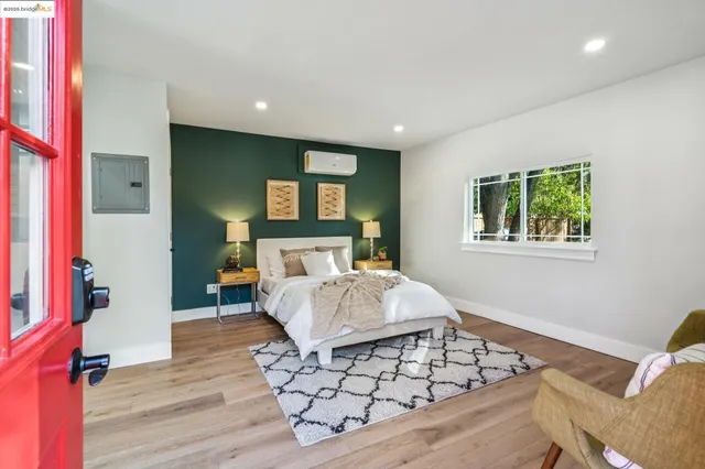 a kitchen with cabinets stainless steel appliances a sink and a window