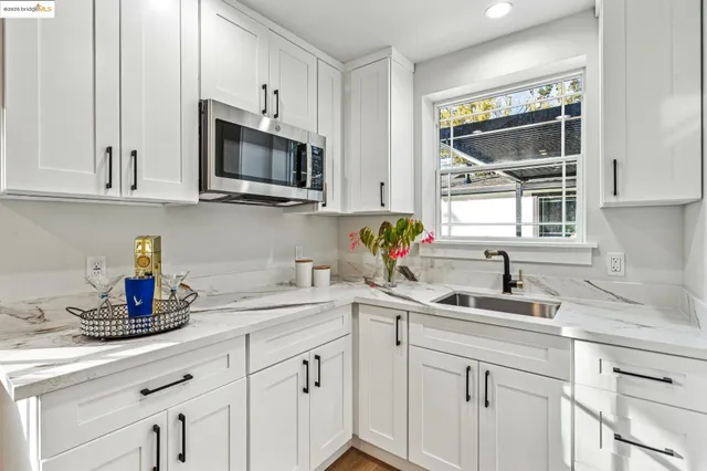 a patio with hardwood table and chairs