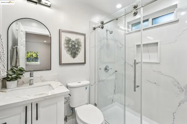 a kitchen with stainless steel appliances kitchen island granite countertop lots of counter top space