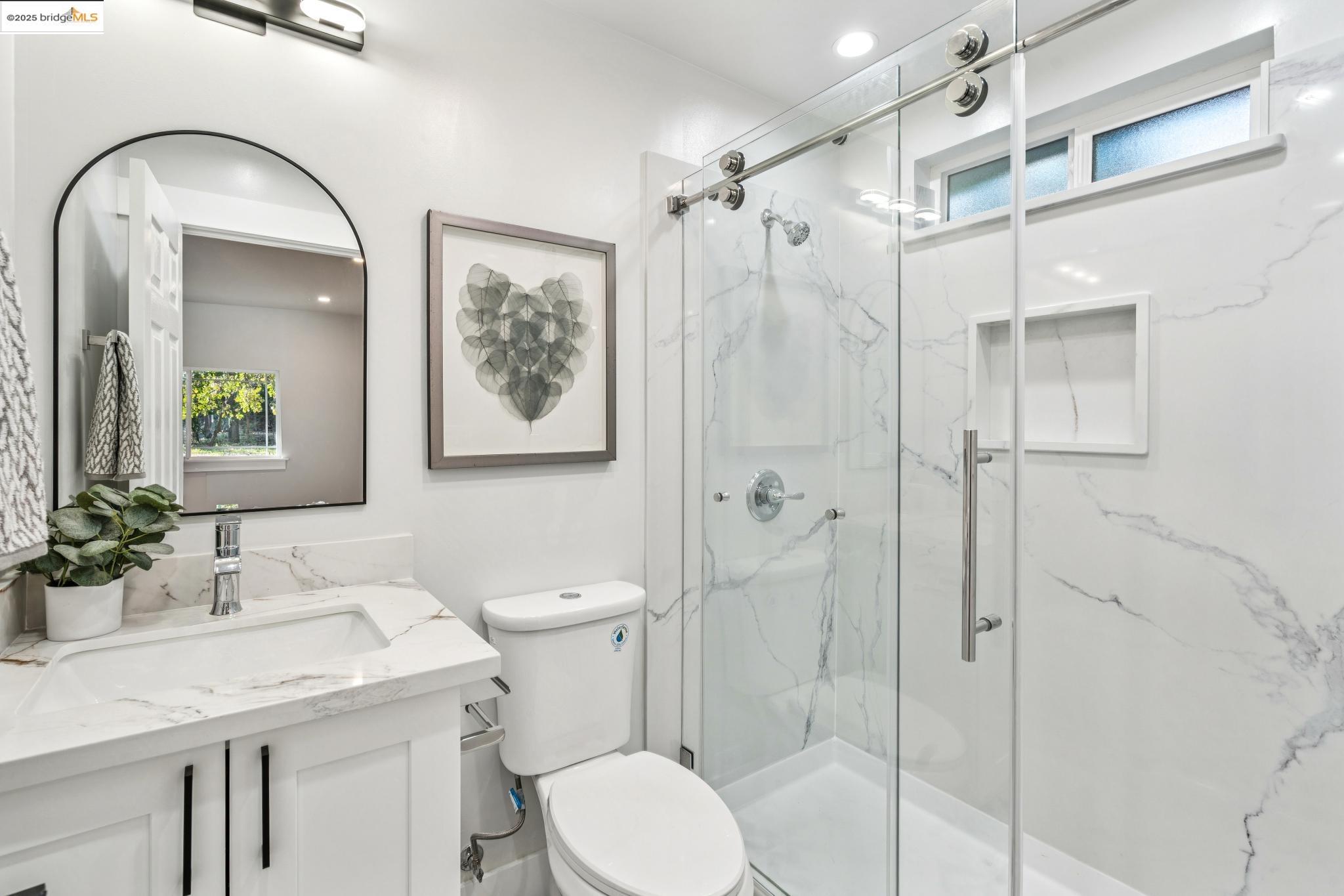 1333 Milton Avenue Walnut Creek, CA 94596 - Photo 38 of 59 a bathroom with a sink toilet and shower