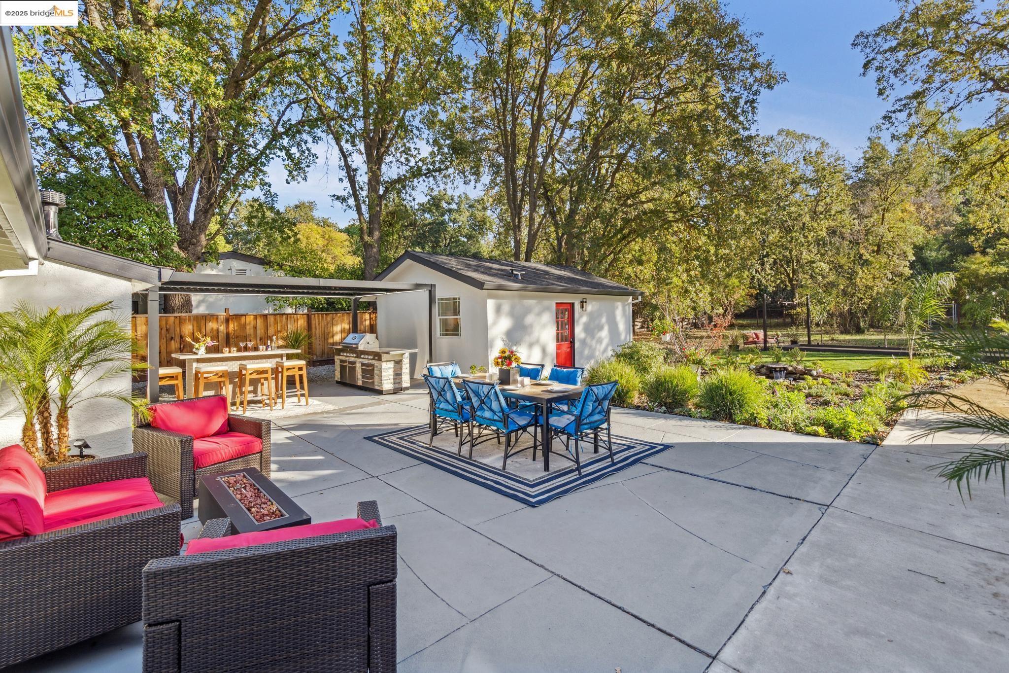 1333 Milton Avenue Walnut Creek, CA 94596 - Photo 40 of 59 a patio with hardwood table and chairs