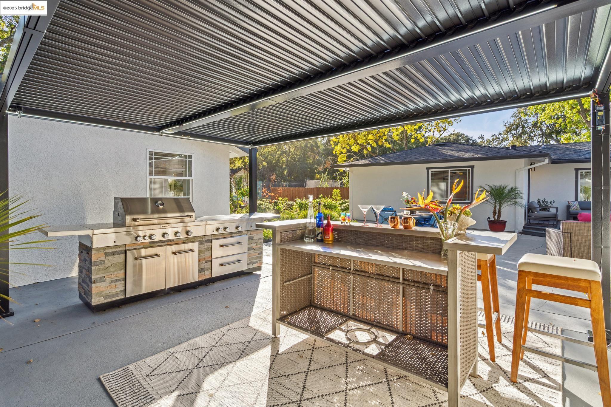 1333 Milton Avenue Walnut Creek, CA 94596 - Photo 41 of 59 a kitchen with stainless steel appliances kitchen island granite countertop lots of counter top space
